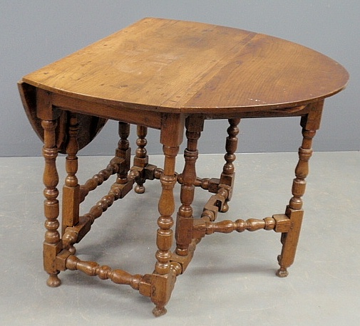 Appraisal: - Jacobean oak drop-leaf gate-leg table with baluster turned legs