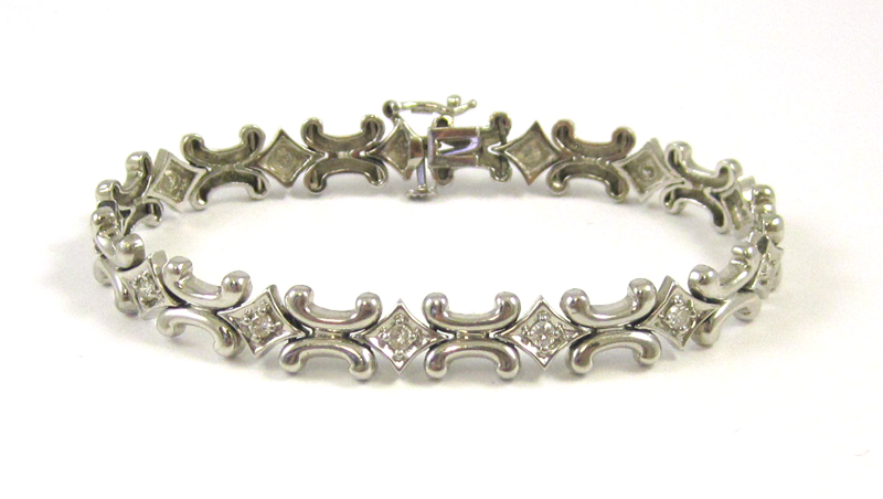 Appraisal: DIAMOND AND FOURTEEN KARAT WHITE GOLD BRACELET measuring inches in