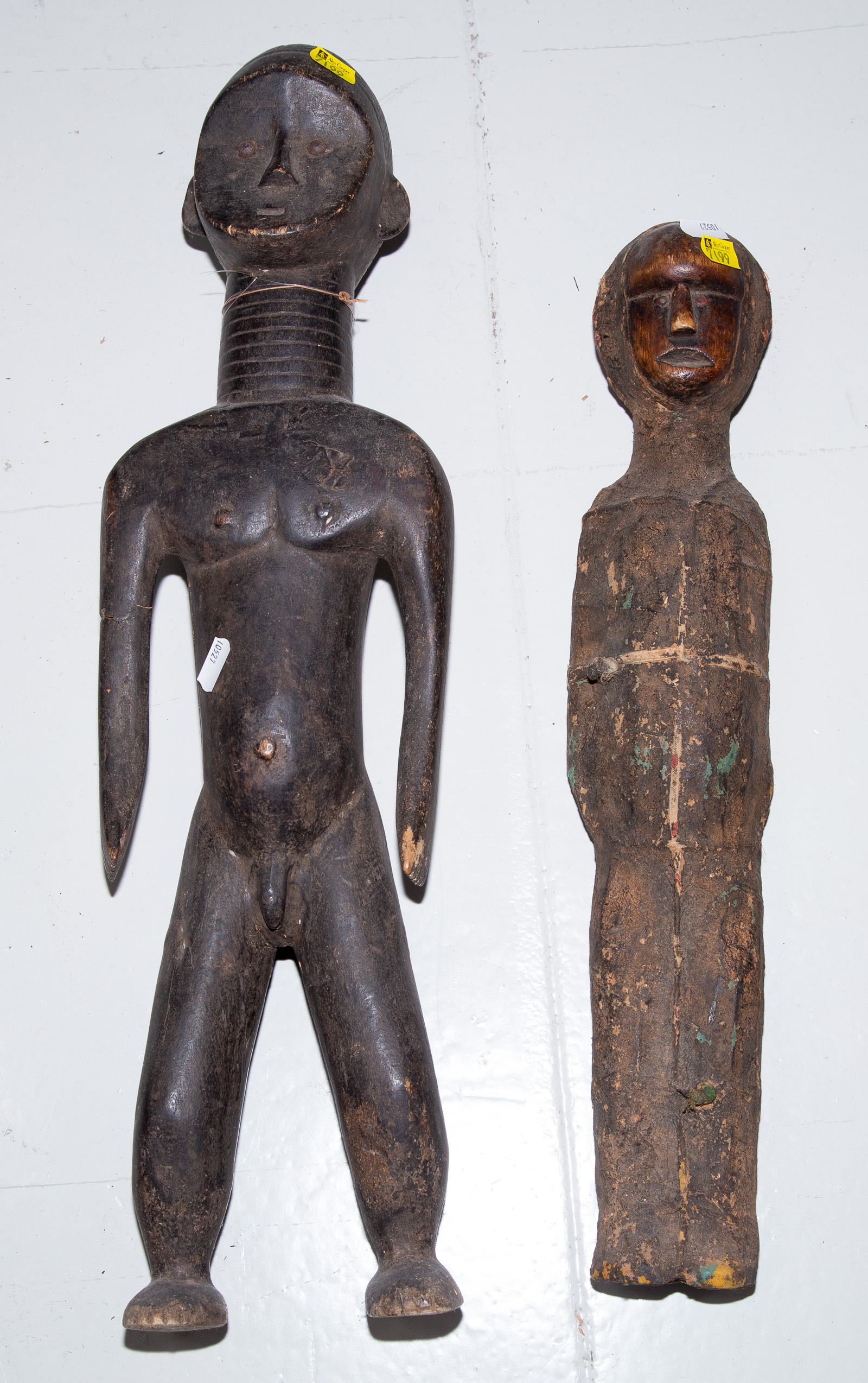 Appraisal: TWO TOMA AFRICAN CARVED WOODEN MASCULINE FIGURES Liberia th century