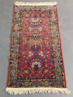 Appraisal: Sarouk mat with floral patterns and red field ' x