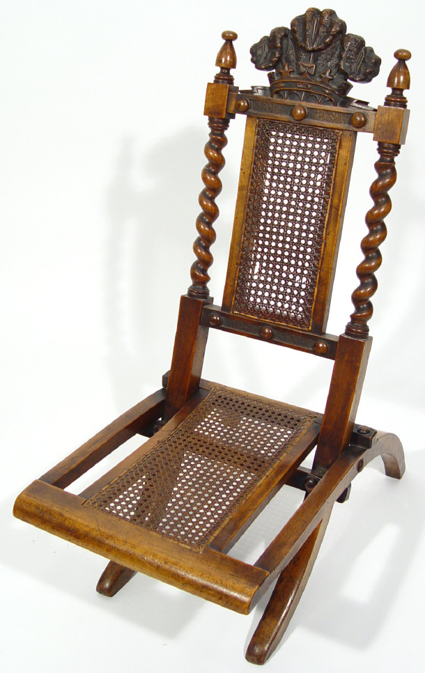 Appraisal: th Century walnut folding chair with reeded back and seat