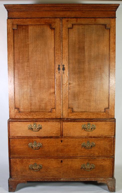 Appraisal: EARLY NINETEENTH CENTURY OAK LINEN PRESS the moulded cornice above