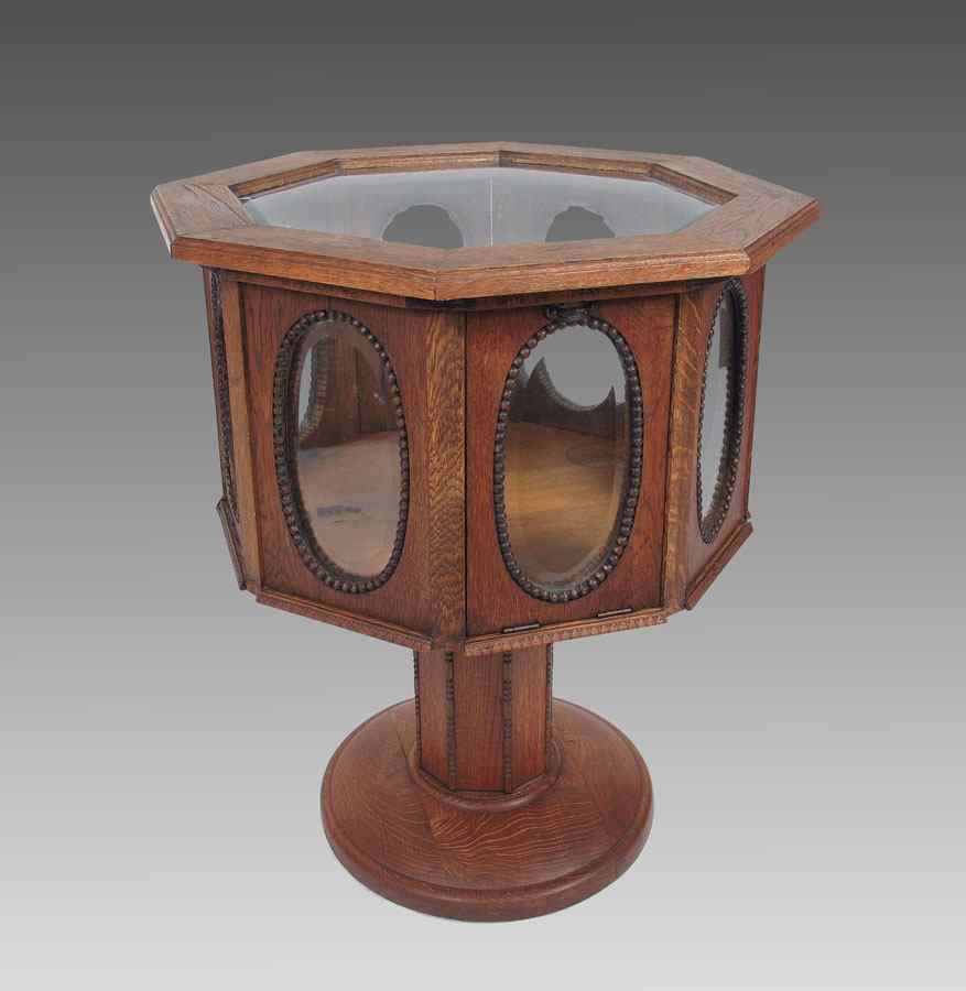 Appraisal: OCTAGONAL VICTORIAN OAK VITRINE Octagon shaped vitrine with glass top