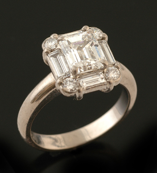 Appraisal: An emerald cut diamond cluster ring The emerald cut diamond