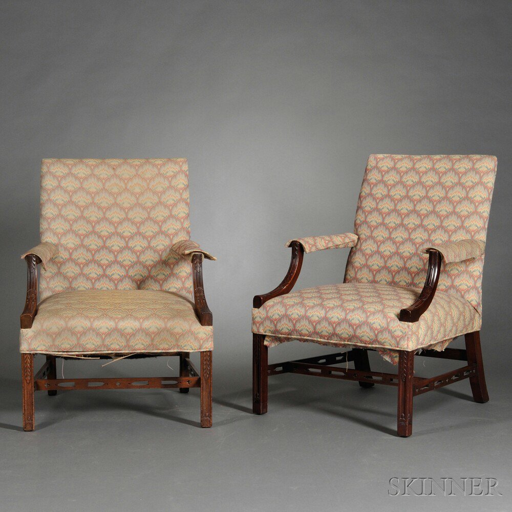 Appraisal: Two Georgian-style Upholstered Mahogany Lolling Chairs England th and th