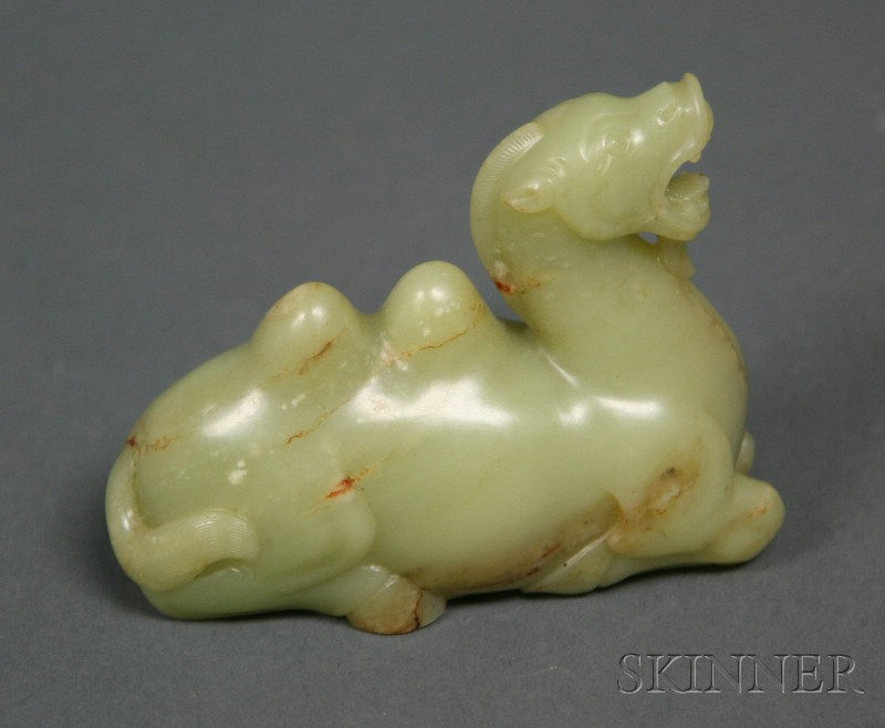 Appraisal: Jade Carving of a Kylin yellow stone with russet markings