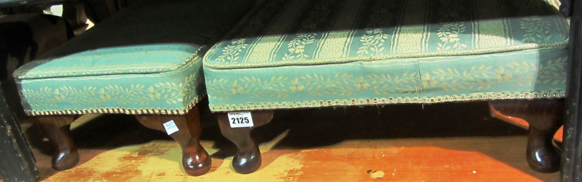 Appraisal: A pair of green upholstered footstools