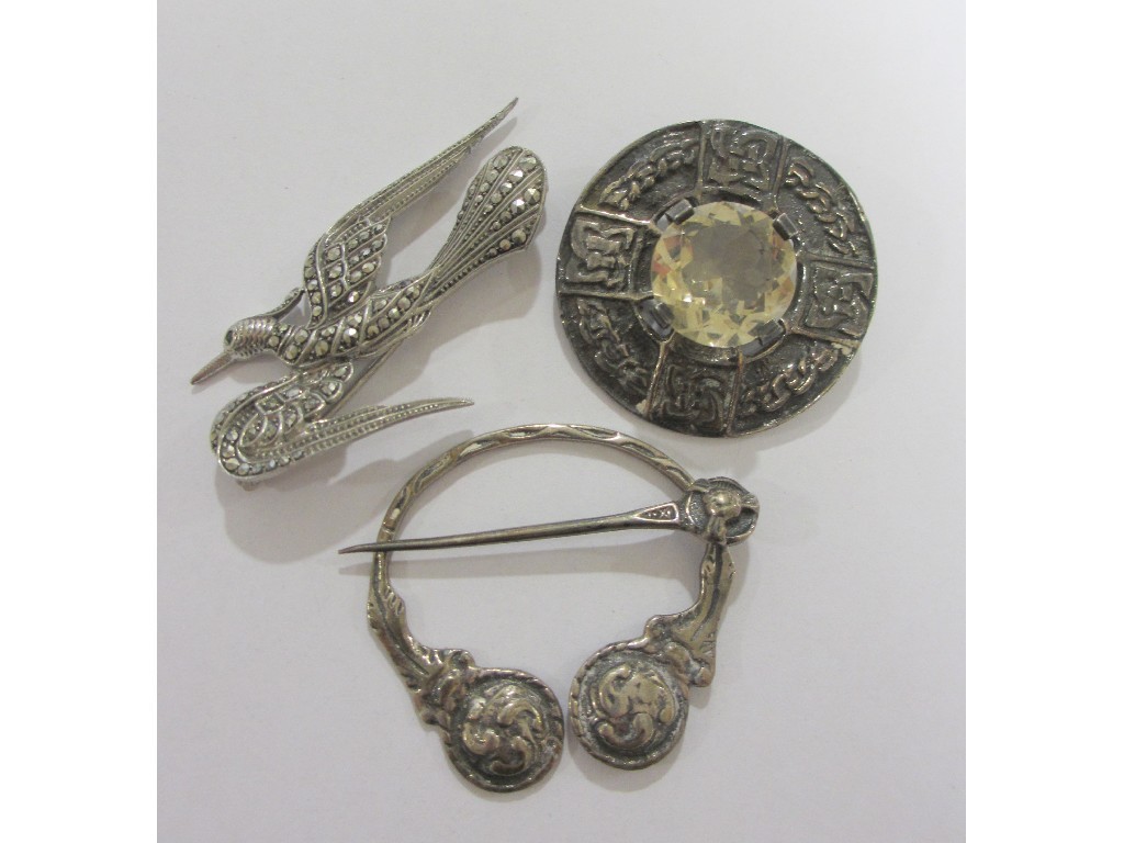 Appraisal: Lot comprising two Celtic silver brooches and a marcasite bird