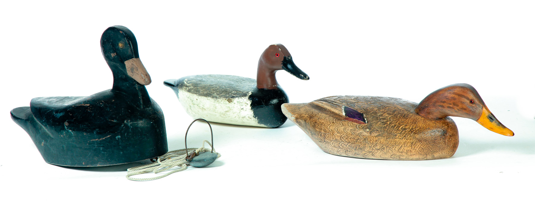 Appraisal: THREE AMERICAN DUCK DECOYS Mid th century Maine surf scooter