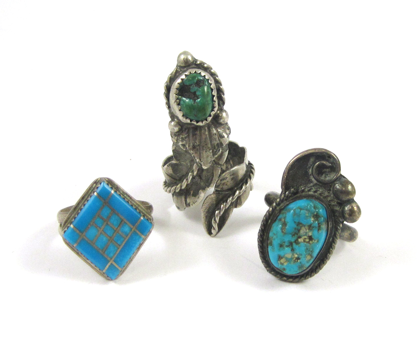 Appraisal: THREE NATIVE AMERICAN SILVER RINGS including a size - silver