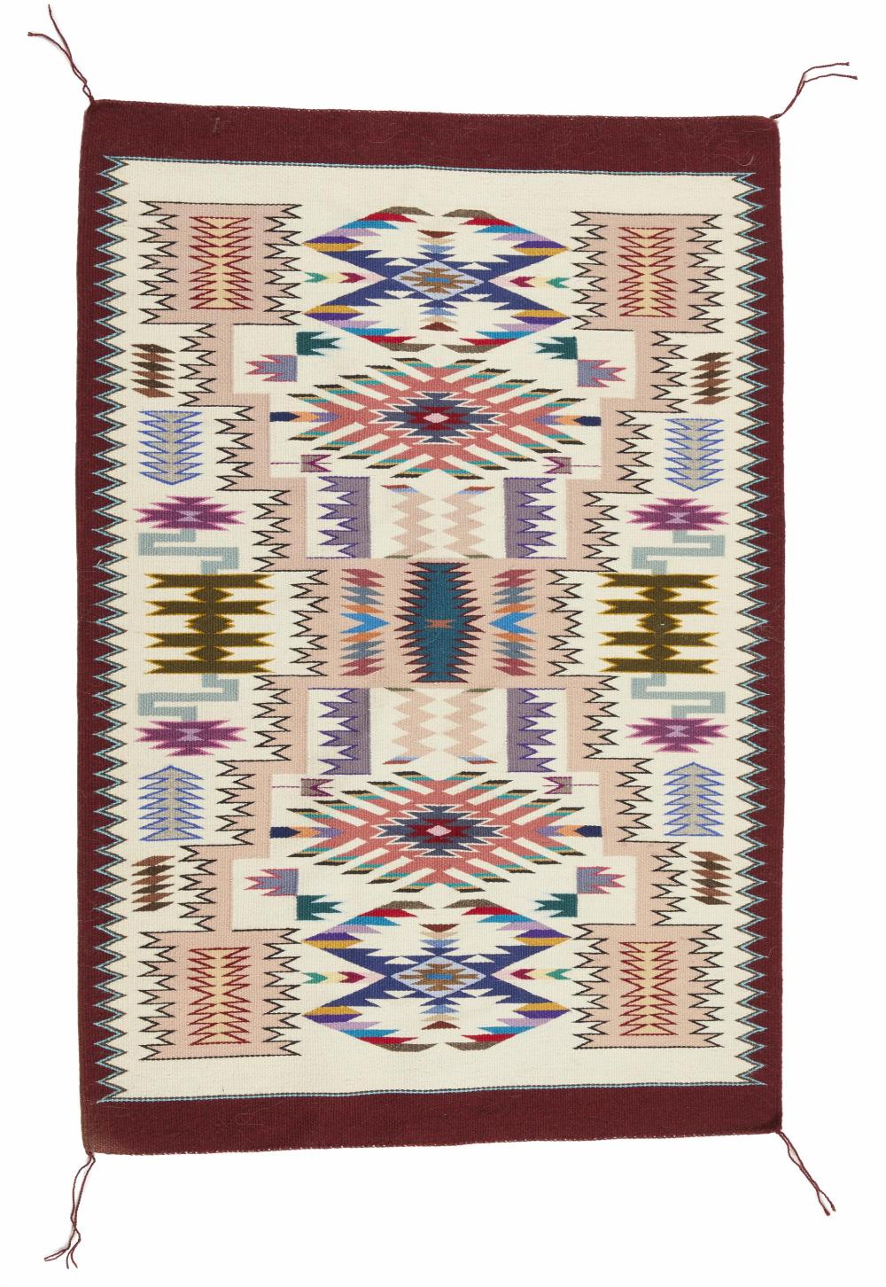 Appraisal: A Navajo jeweled storm pattern rug by Lily Touchin Fourth-Quarter