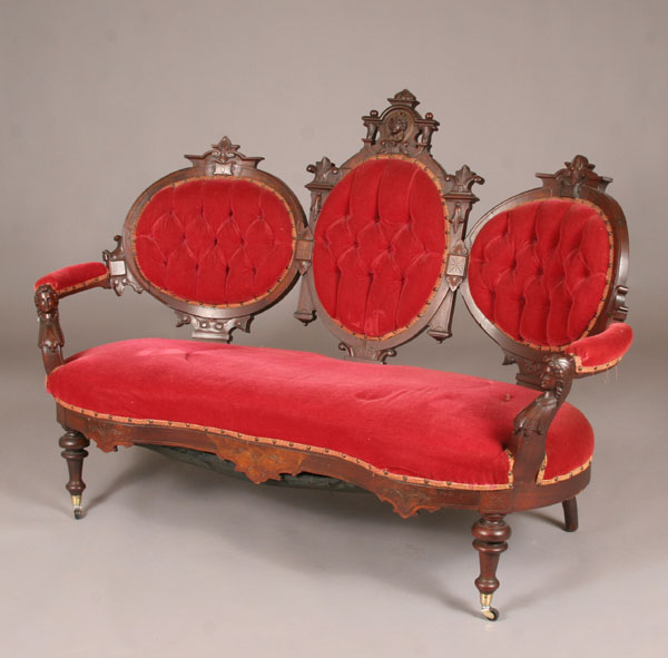 Appraisal: Mid-victorian settee Jeliff-style carved classical faces on arms and back