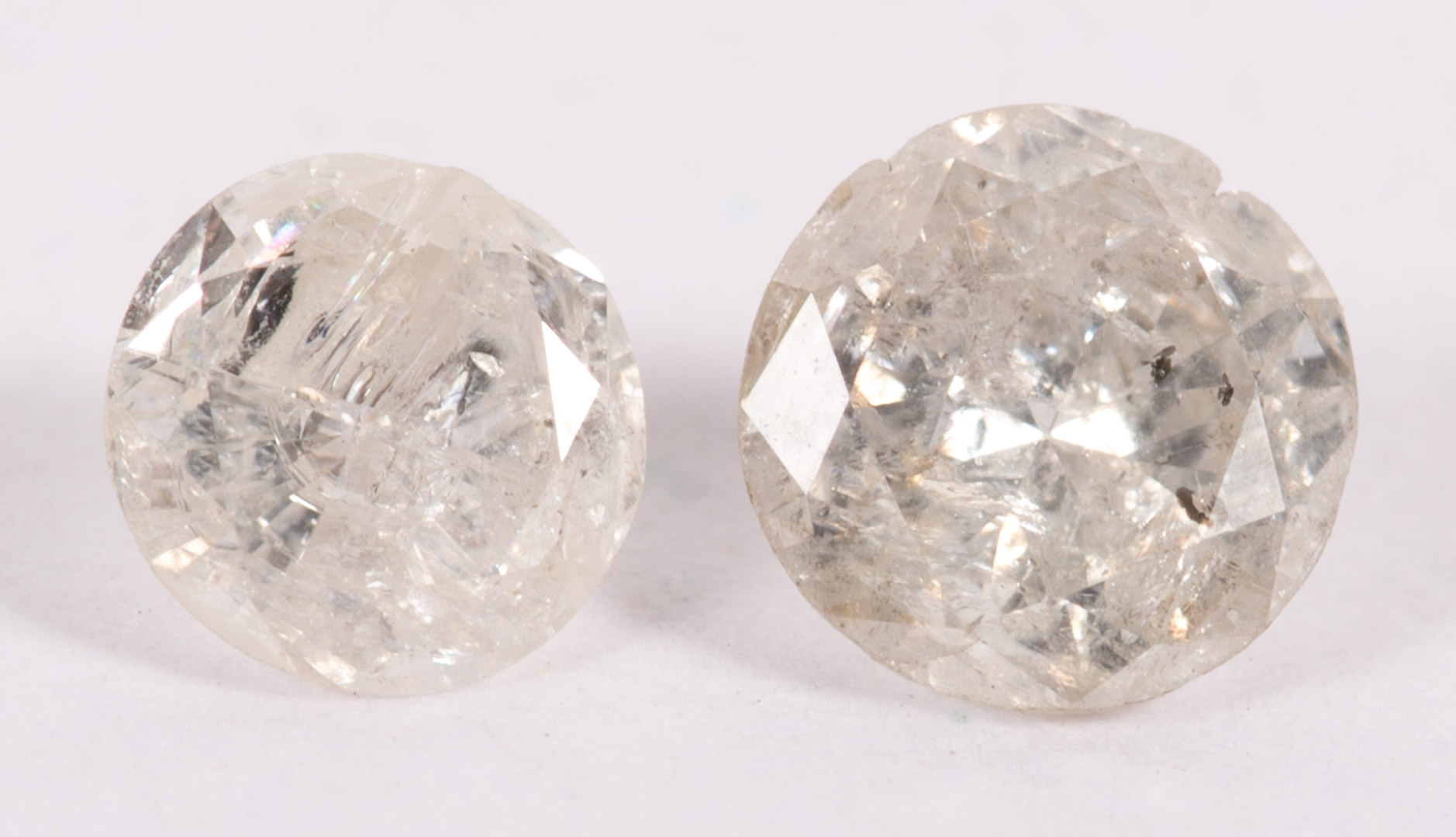 Appraisal: A Pair of Unmounted Diamonds two round brilliant diamonds approximately