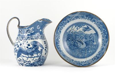 Appraisal: A blue and white jug printed with exotic birds beside