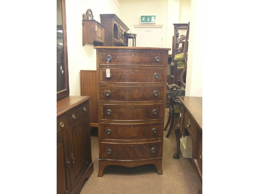 Appraisal: A mahogany-veneered bedroom chest bow-fronted with six drawers each cock-beaded