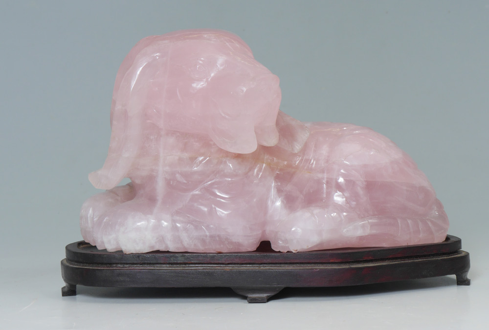 Appraisal: CHINESE CARVED PINK QUARTZ DOG Figure of a recumbent dog