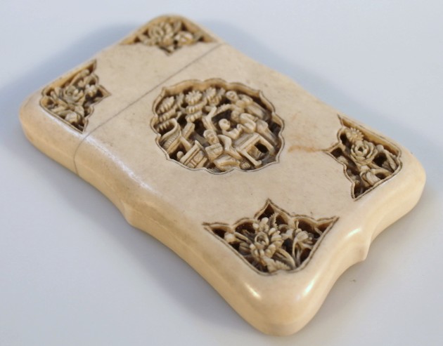 Appraisal: A thC Chinese ivory card case the rectangular body partly