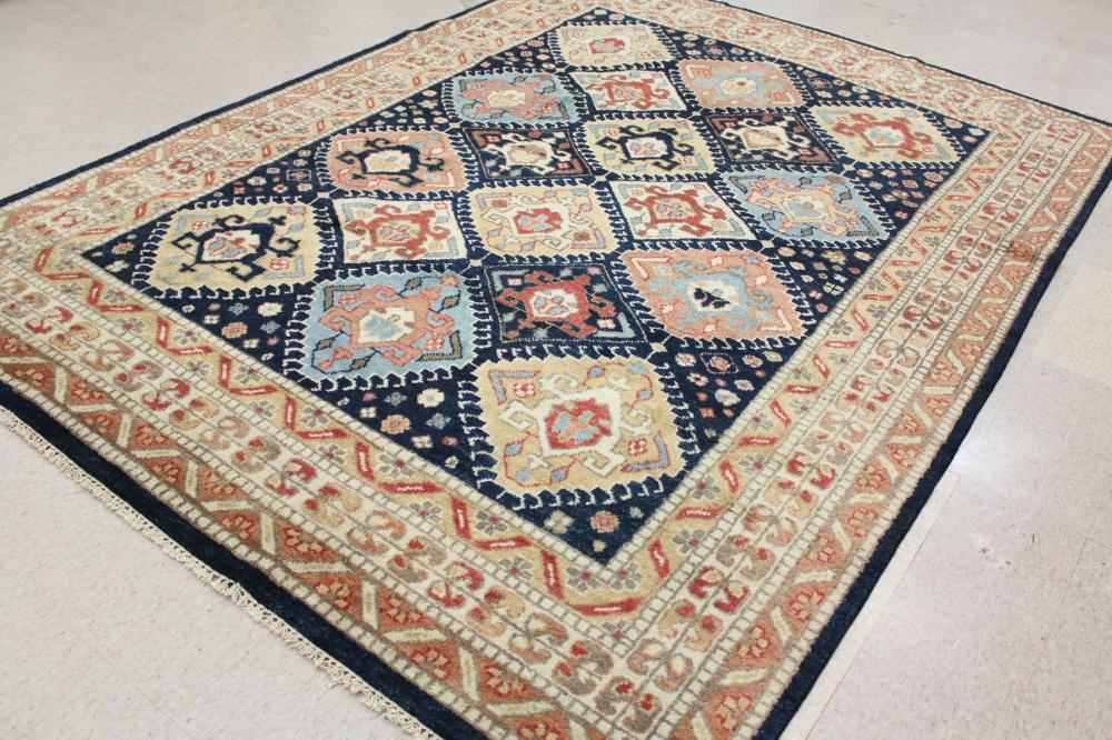 Appraisal: HAND KNOTTED ORIENTAL WOOL CARPET Indo-Persian tribal design featuring geometric