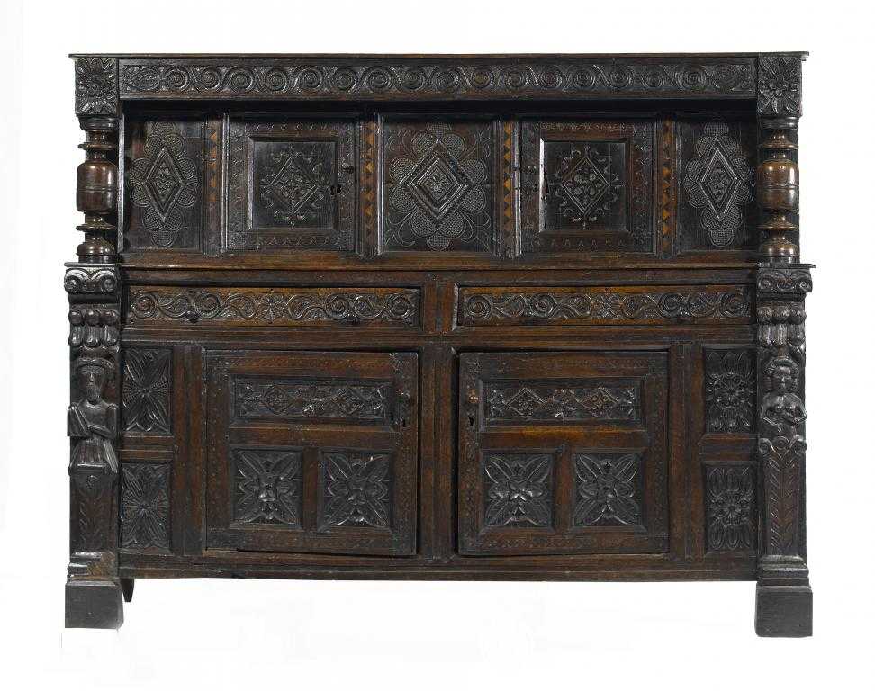 Appraisal: A CHARLES II OAK LIVERY CUPBOARD the frieze carved with