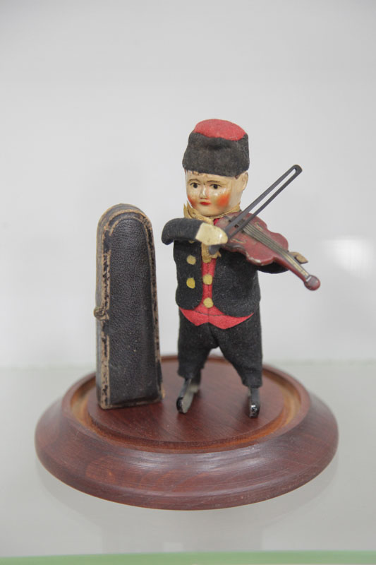 Appraisal: SCHUCO BOY WITH VIOLIN TIN WIND UP TOY A boy