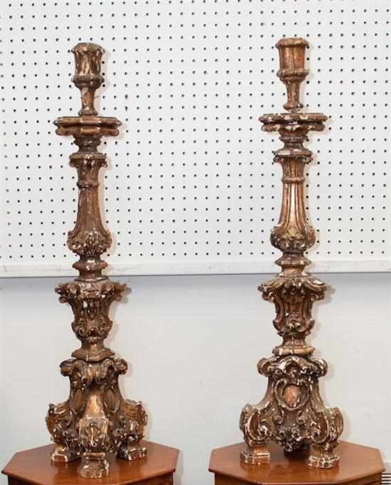 Appraisal: Pair of Gothic style carved wood altar candlesticks Estimate -