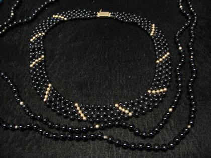 Appraisal: Two black onyx bead necklaces one of woven mesh form