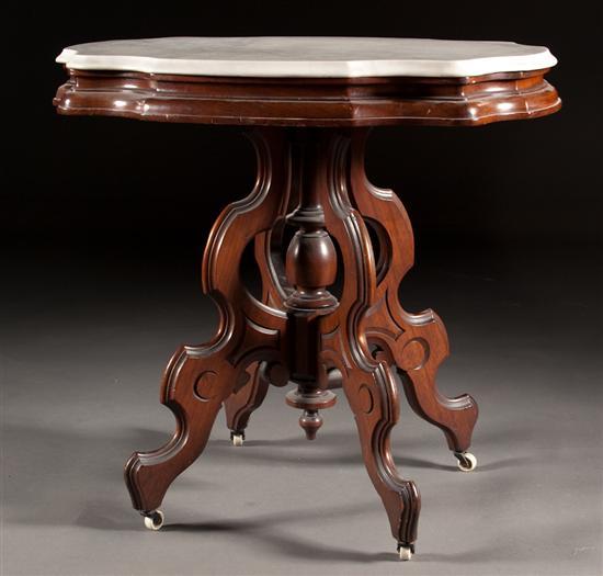 Appraisal: Victorian carved walnut marble turtle-top side table fourth quarter- th