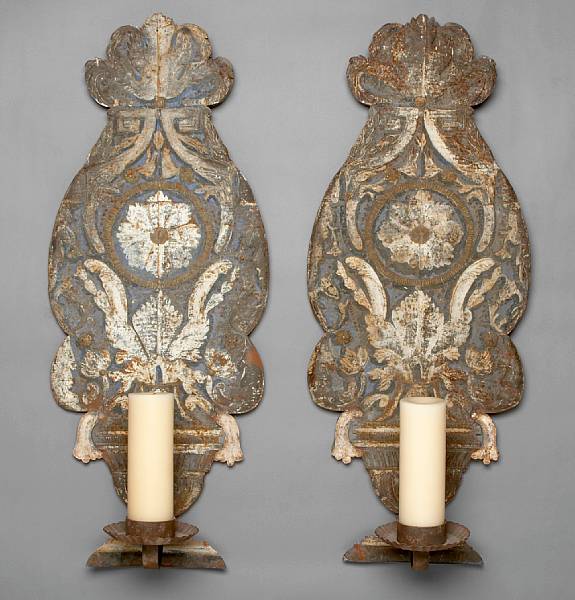 Appraisal: A pair of Italian repousse tole painted wall lights th