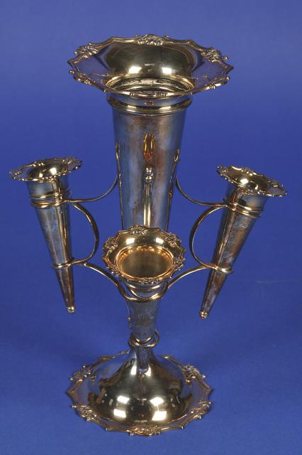 Appraisal: A GEORGE V EPERGNE of circular tapering form with wirework