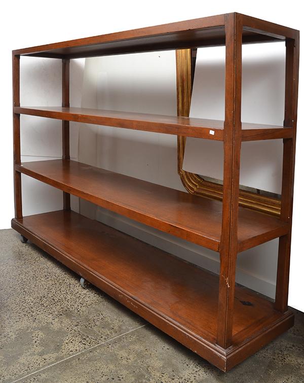 Appraisal: AN OPEN BOOKCASE ON CASTORS the body consisting of four