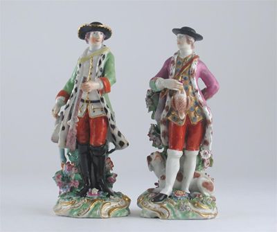 Appraisal: A pair of Chelsea figures of sportsmen one holding a