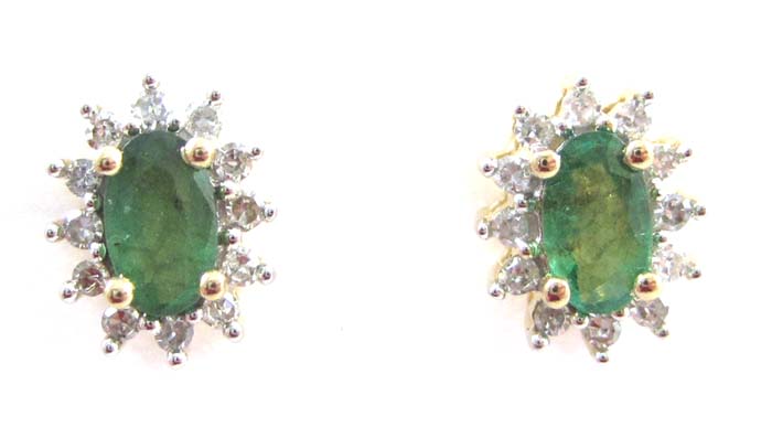 Appraisal: PAIR OF EMERALD AND DIAMOND EARRINGS each k yellow gold