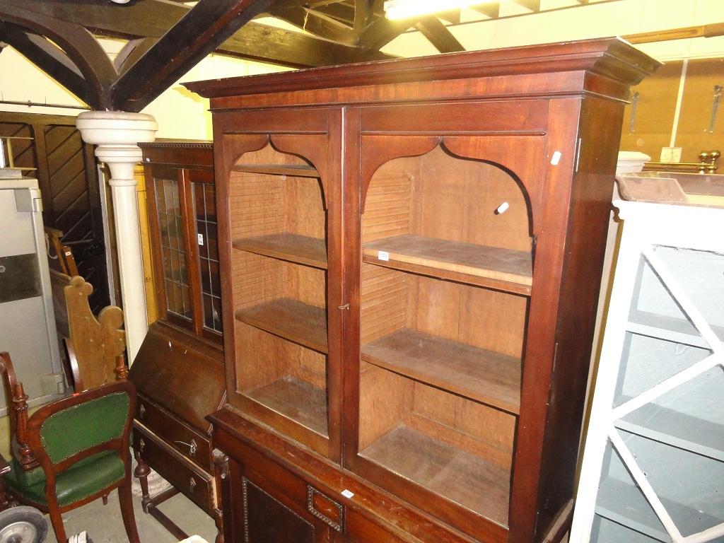 Appraisal: A th century mahogany bookcase with stepped and moulded cornice