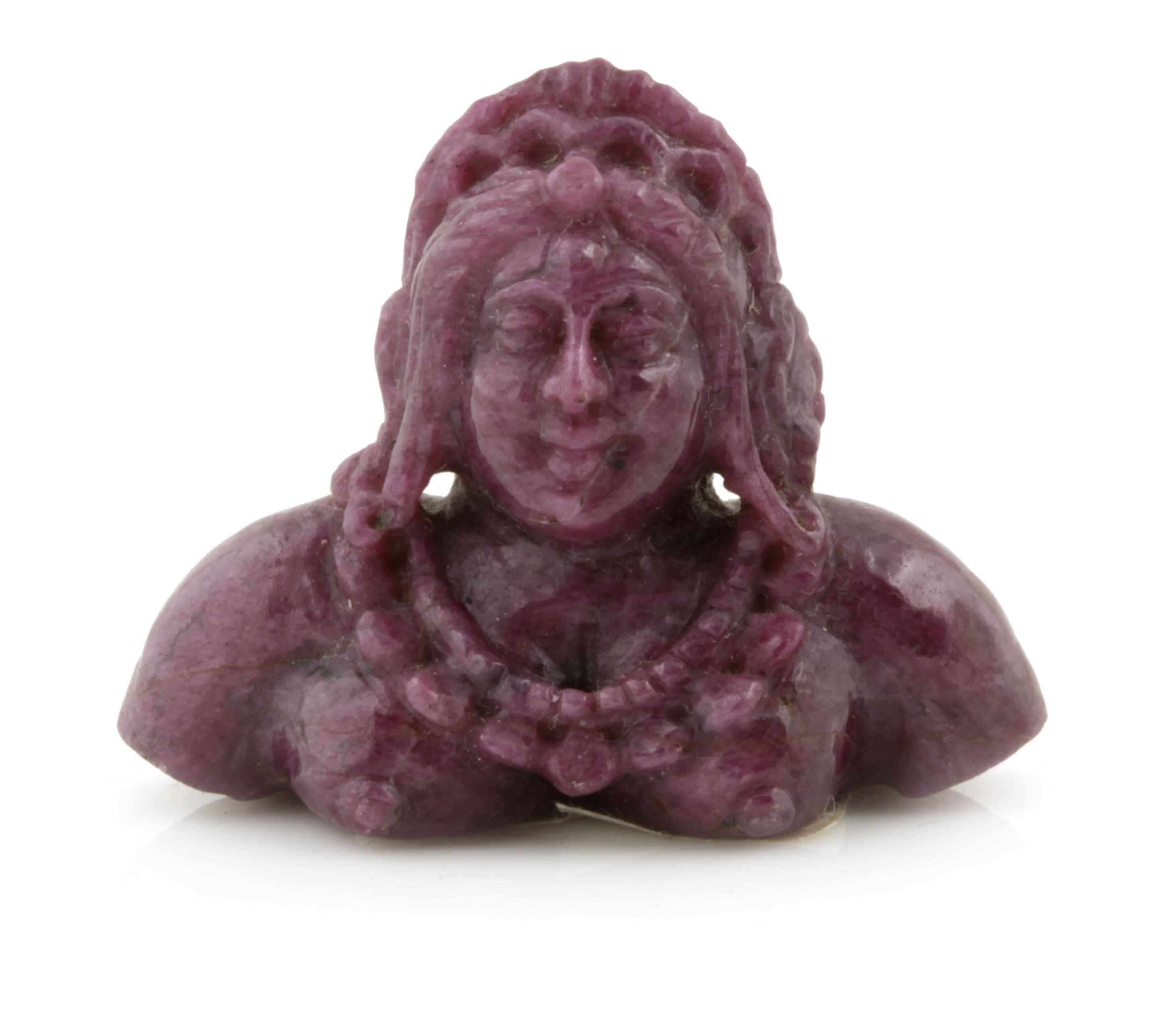 Appraisal: Carved Ruby Depicting a female bust wearing traditional Indian accessories