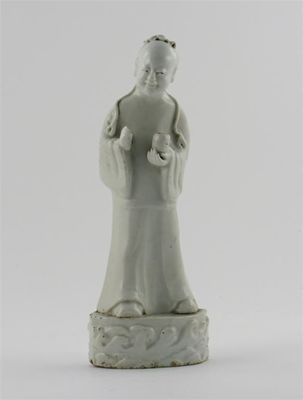 Appraisal: A Chinese moulded white-glazed figure of a man smiling and