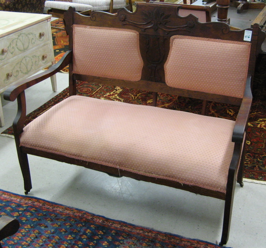 Appraisal: LATE VICTORIAN SETTEE AND MATCHING ARMCHAIR American c the mahogany