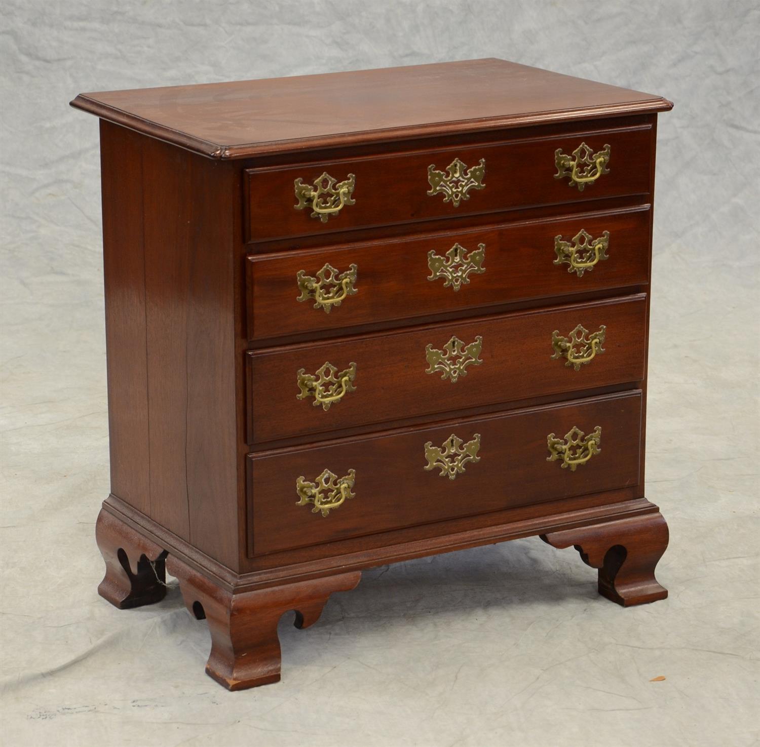 Appraisal: Benchmade mahogany Chippendale style bachelor's chest rectangular molded top with