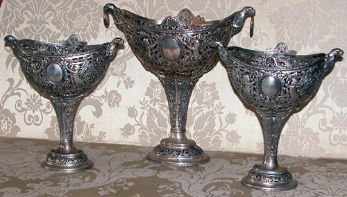 Appraisal: Title pc Continental Garniture set with footed oval-shaped comports putti