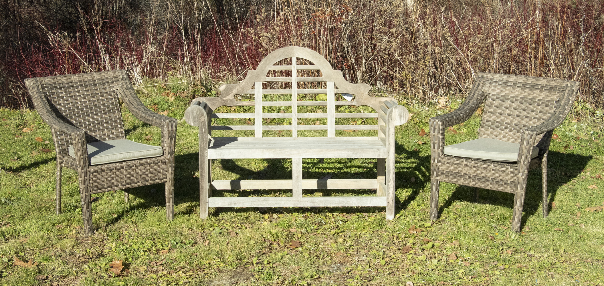 Appraisal: ORIENTAL-STYLE TEAK LAWN SETTEE W WOVEN LAWN CHAIRS A wooden