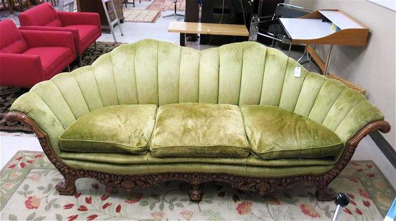 Appraisal: A CARVED AND GREEN UPHOLSTERED SOFA American c s a