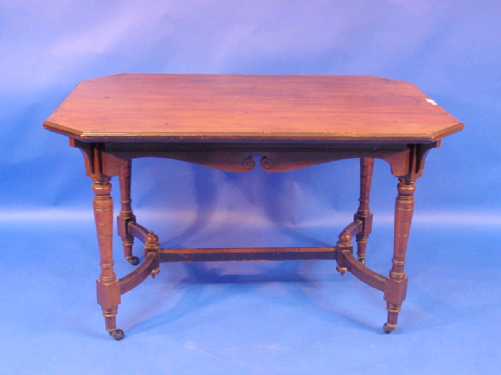 Appraisal: A Victorian walnut centre table with canted and moulded rectangular