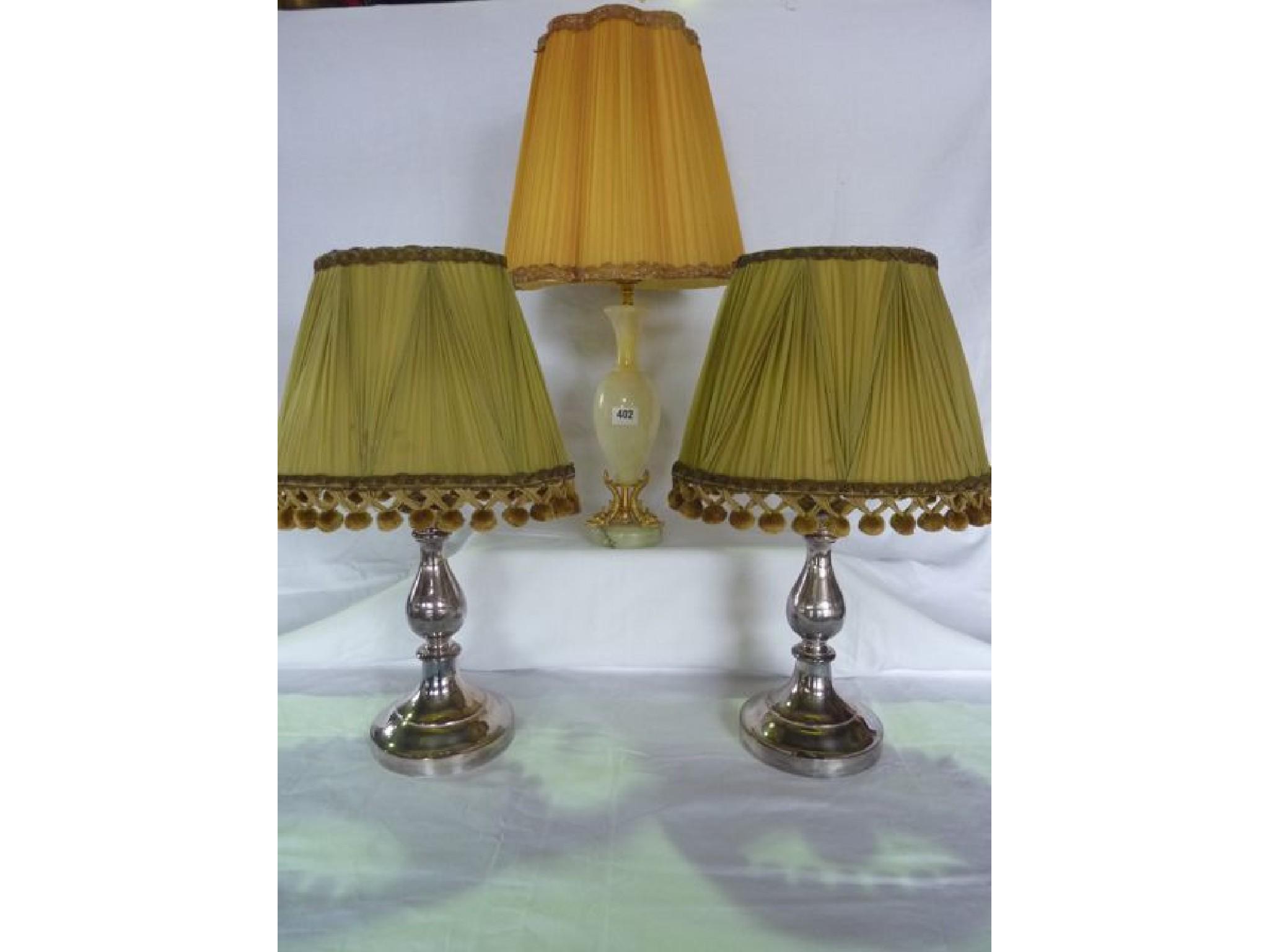 Appraisal: A pair of heavy plated table lamps in the form