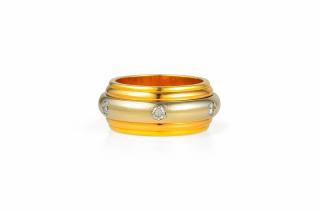 Appraisal: A Cartier Gold and Diamond Rolling Ring A Cartier Gold