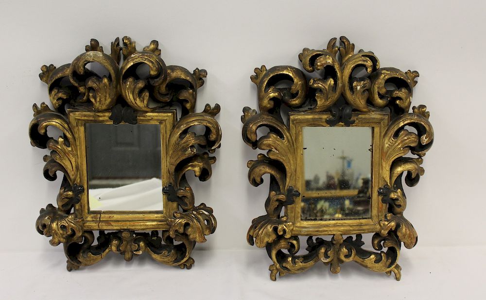 Appraisal: Pair of Small Italian Giltwood Rococo Carved Mirrors Good age