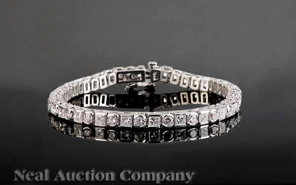 Appraisal: A kt White Gold and Diamond Link Bracelet with princess