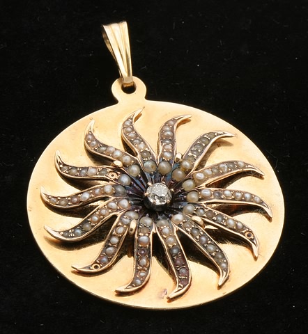 Appraisal: KY mm disk with sunburst design accented with seed pearls