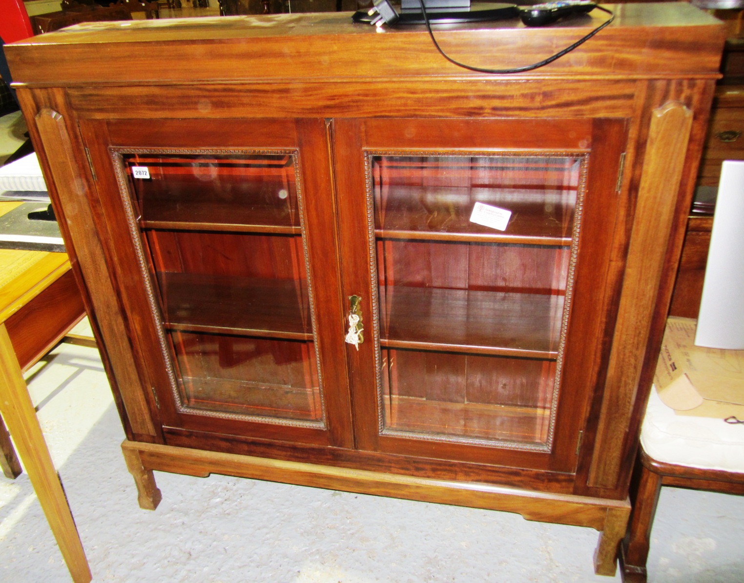 Appraisal: A th century mahogany glazed bookcase