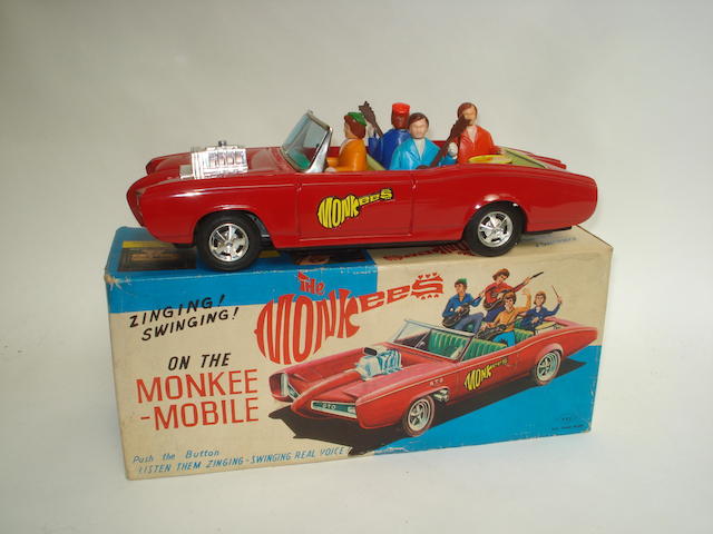 Appraisal: Aoshin battery operated Monkee-mobile Japanese circa Red tinplate car with