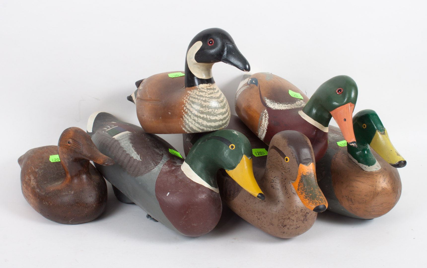 Appraisal: Six carved wood duck decoys and figures three carved and