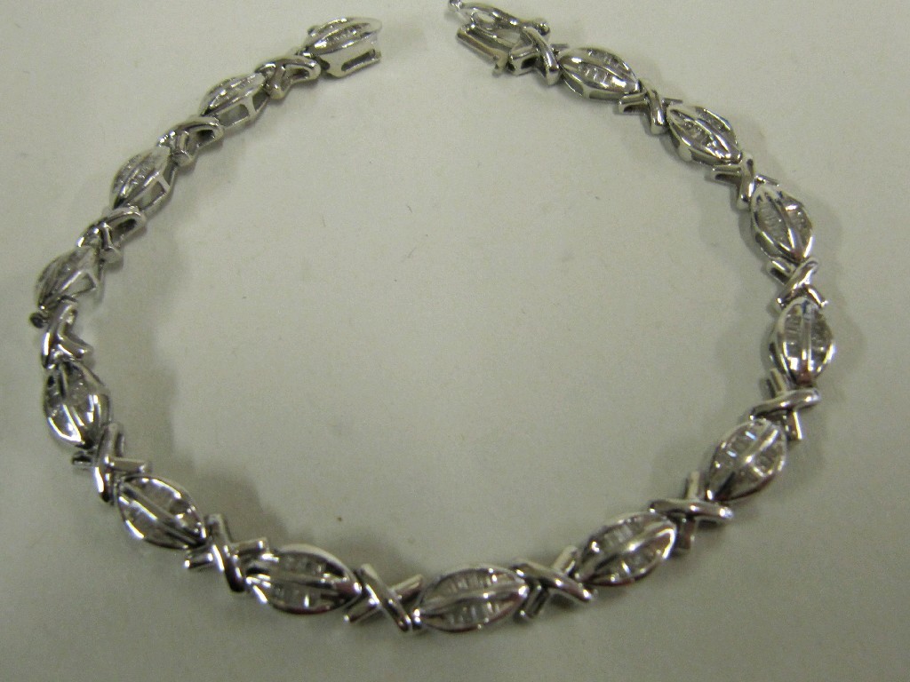 Appraisal: Fourteen carat white gold baguette cut diamond set line bracelet